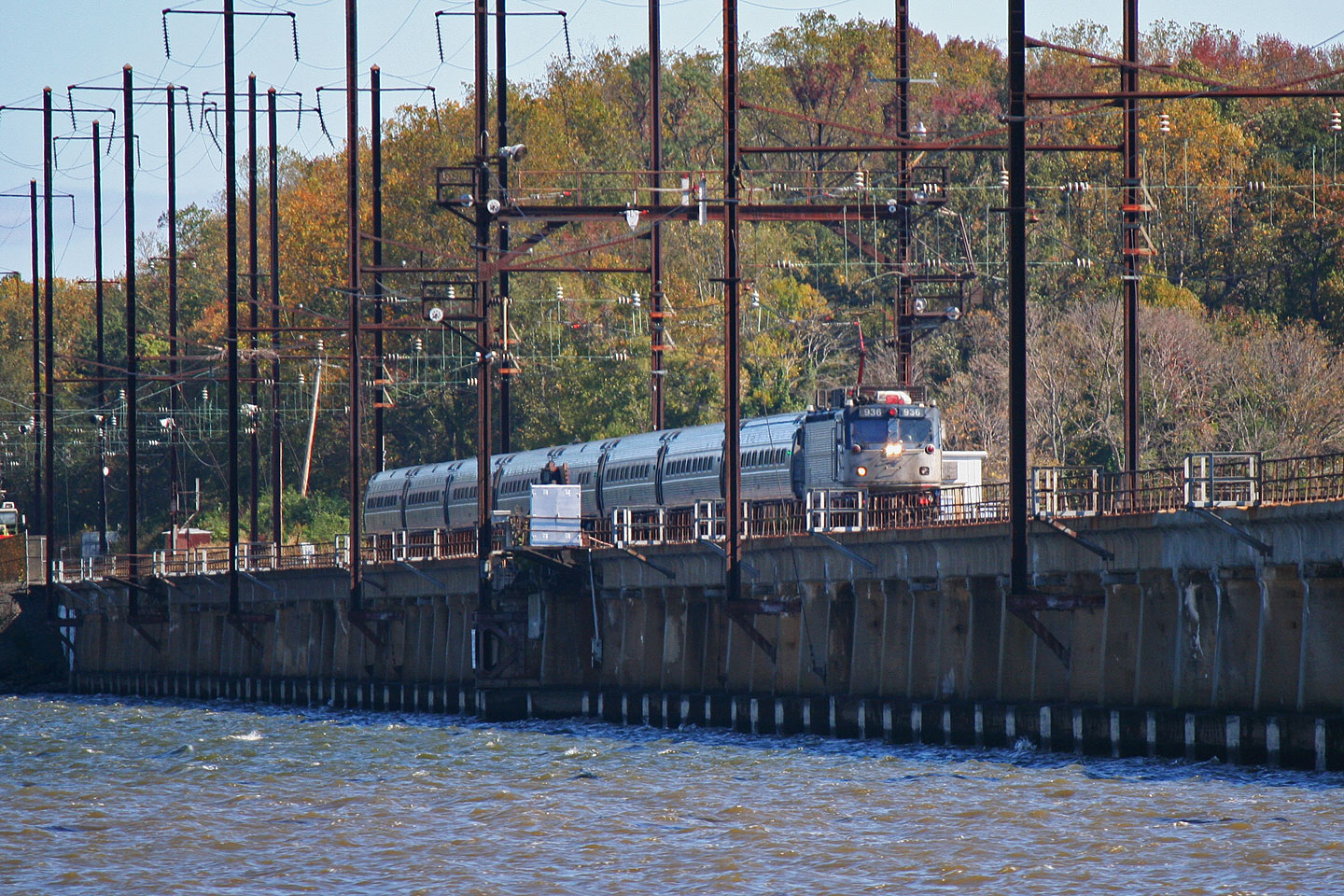 A veteran AEM7 leads this southbound Amtrak regional across the Bush River bridge.